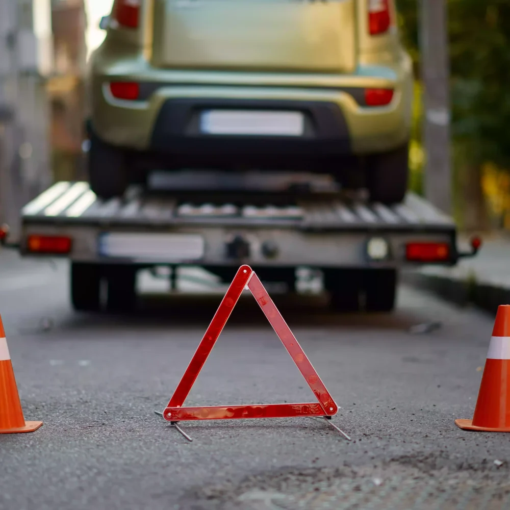 warning-triangle-and-traffic-cone-on-road-2023-11-27-04-59-08-utc