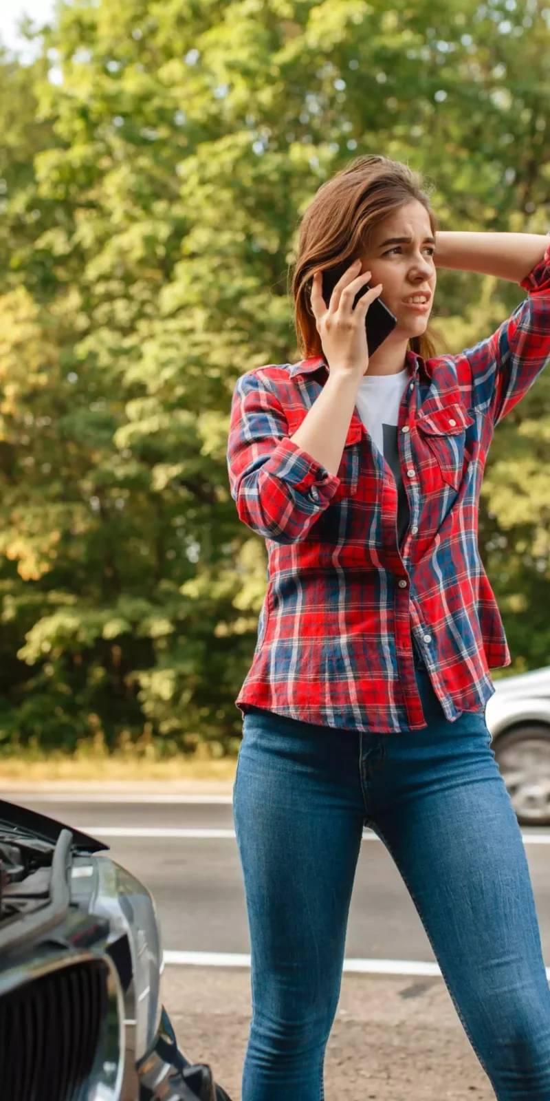 woman-calling-a-tow-truck-on-road-car-breakdown-2023-11-27-05-04-55-utc