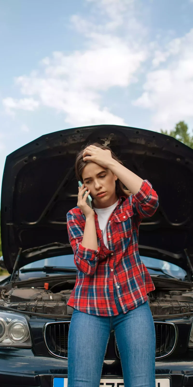 woman-calling-a-tow-truck-on-road-car-breakdown-2023-11-27-05-32-32-utc